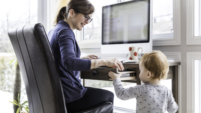 Mother Working From Home with Kid